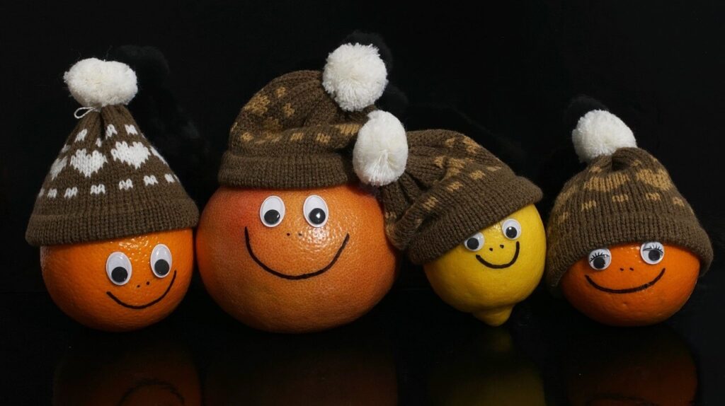 Glückliche Familie als Zitrusfrüchte